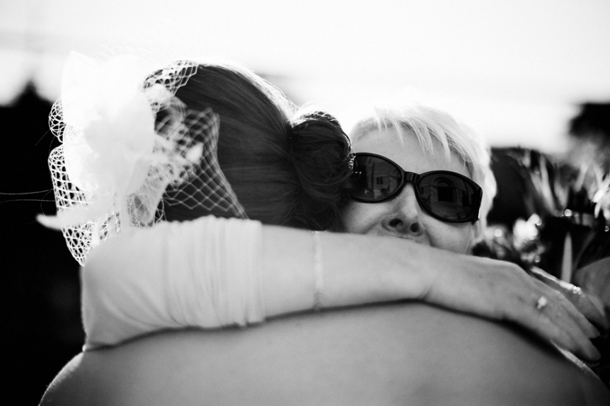 big hug at a wedding by Kitchener wedding photographer