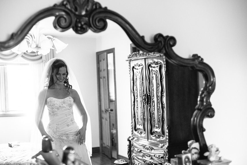 a happy bride at her Ancaster home as photographed by  wedding photojournalist