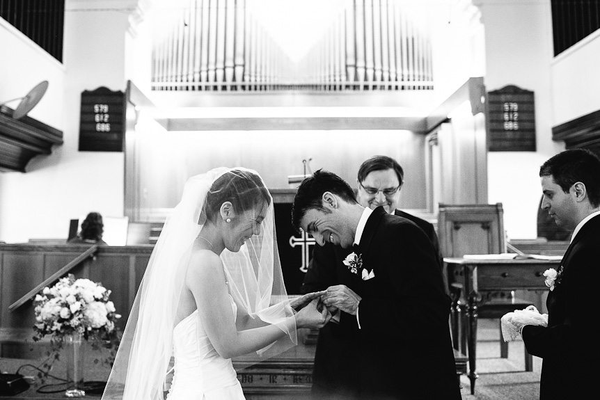 the bride and groom exchanges rings at the Streetsville United Church in Mississauga, Ontario