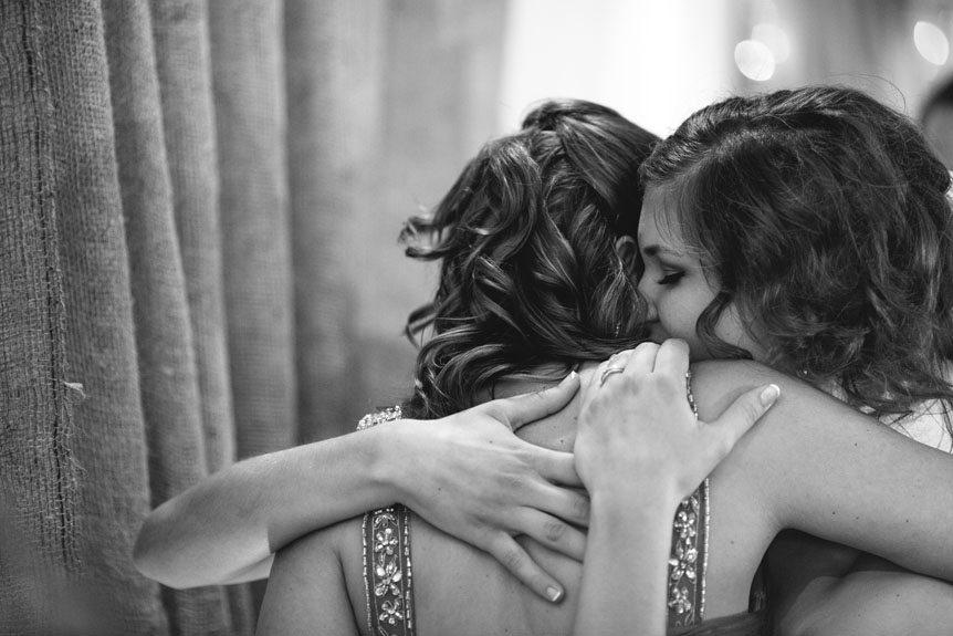 the bride and her Mom embraces after the speech at a wedding reception at the Listowel Golf Country Club