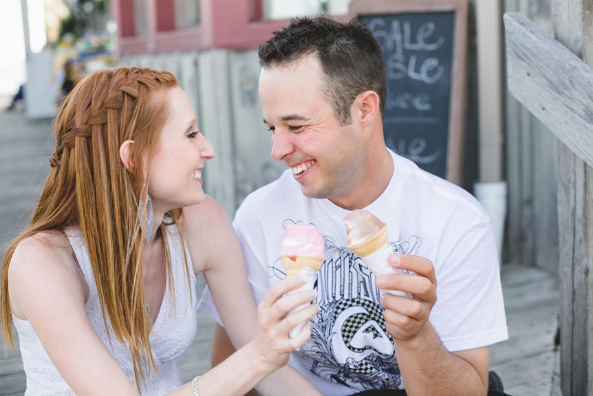 a sweet moment captured at an engagement session in Port Dover by  fine art wedding photographer