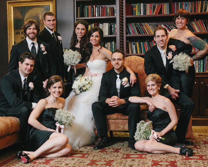 gorgeous wedding party at the Queen's Landing Hotel's library as photographed by Toronto fine art wedding photographer