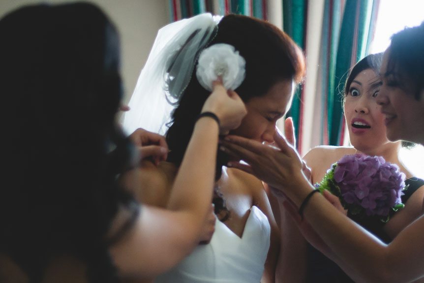 a funny moment between the bride and her bridesmaids by Toronto documentary wedding photographer