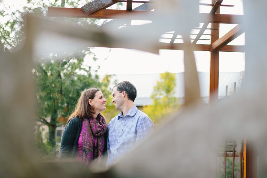 an artful engagement portrait featuring sculptures as photographed by Elora wedding photographer