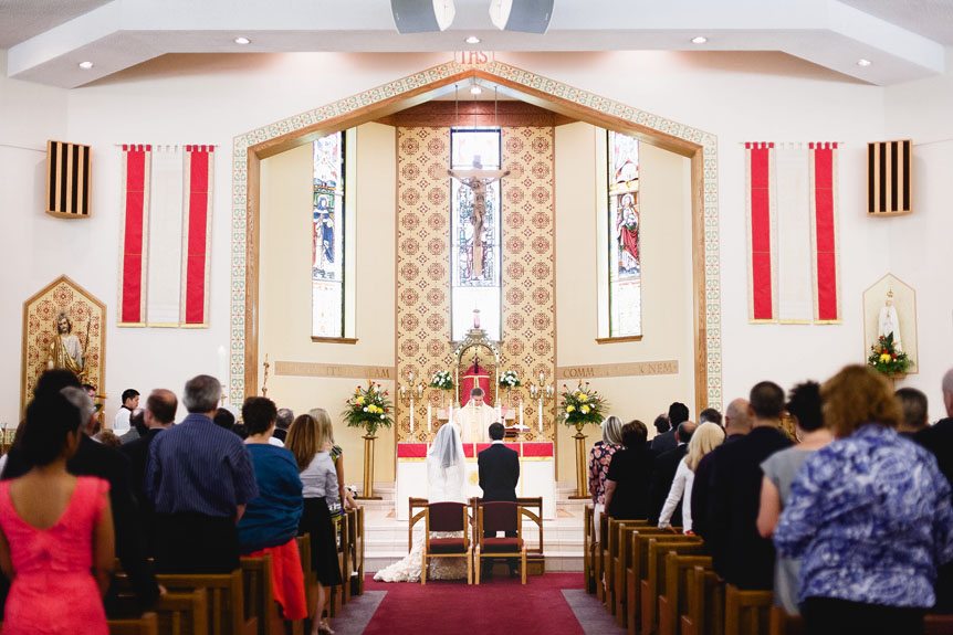 The bride and groom get married at a church in Mississauga.