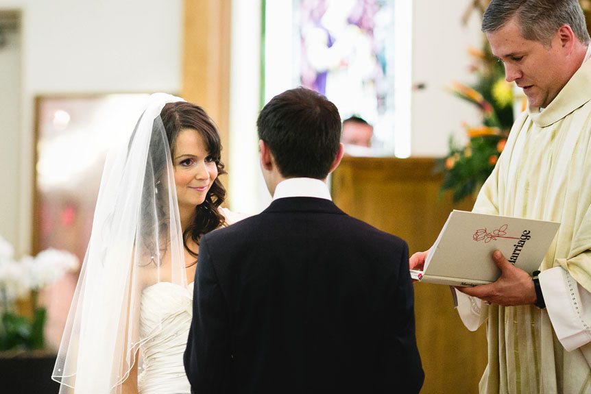 Newmarket Wedding Photographer photographs the bride and groom exchange vows.