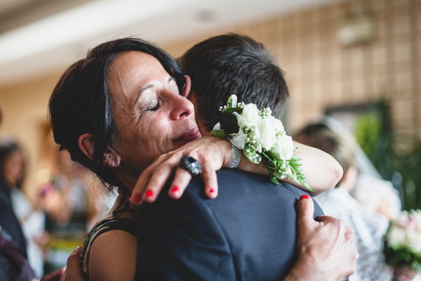 A memorable moment between the groom and his mother as photographed by Newmarket Wedding Photographer.