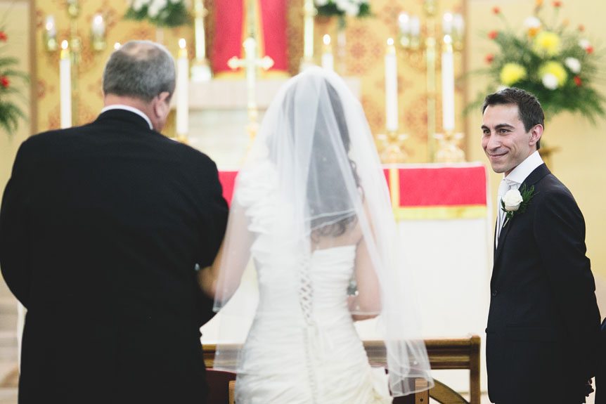 The groom sees his bride walk up the aisle as captured by Newmarket Wedding Photographer.