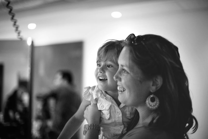 Cambridge documentary wedding photographer captures a little girl enamoured of the bride getting ready.