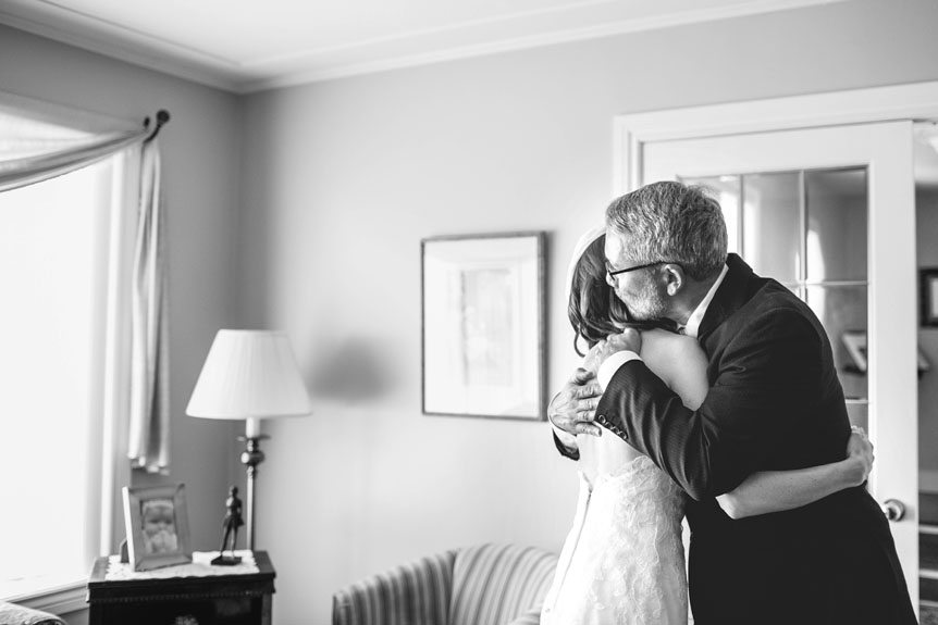 Cambridge Documentary Wedding Photographer photographs an emotional moment between the bride and her father.
