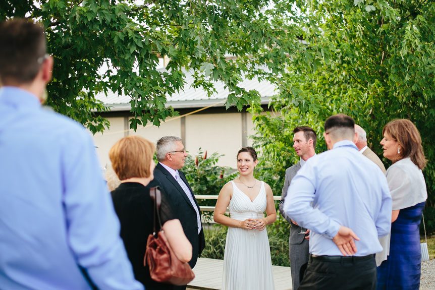 The bride and groom meets their guests at their Flat Rocks Cellars wedding by Jordan, Ontario wedding photographer.