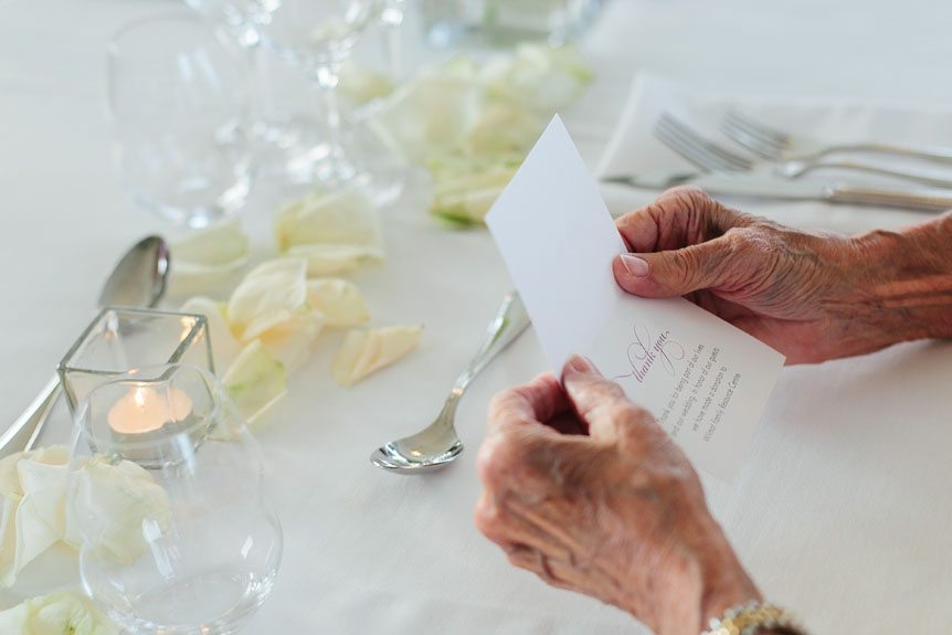 The bride's grandmother reads a note from the bride and groom at their Flat Rocks Cellars wedding as photographed by Jordan, Ontario wedding photographer.