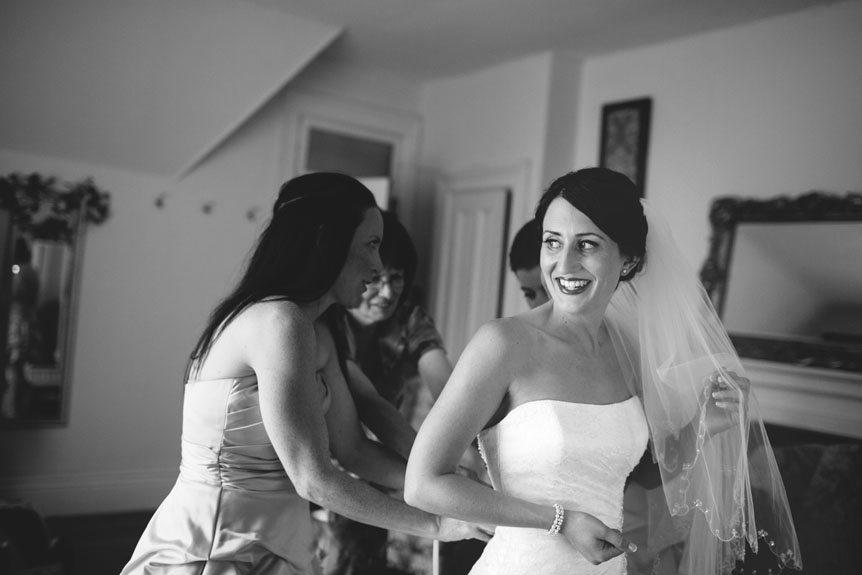 The bride gets ready moment before she walks down the aisle as photographed by Documentary Style Wedding Photography studio.