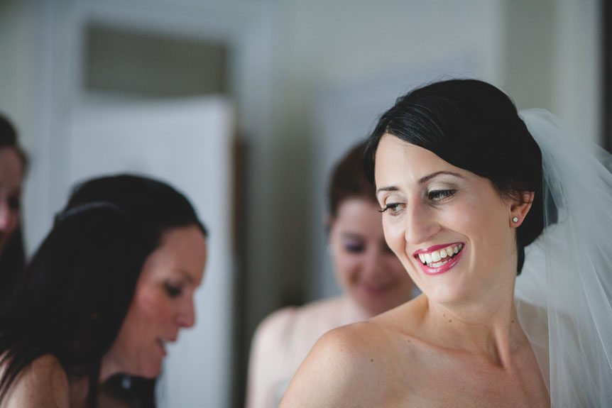 A candid portrait of the bride as she got ready for her Penryn Mansion wedding as photographed by Documentary Style Wedding Photography studio.