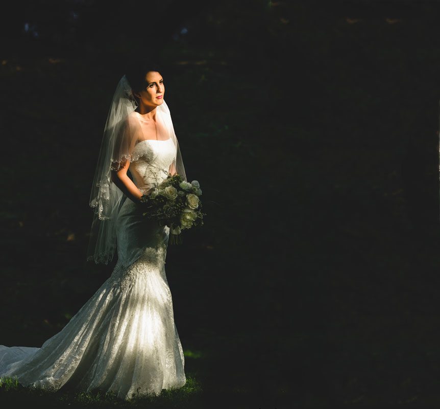 Documentary Style Wedding Photography studio captures a dramatic portrait of the bride on her wedding day.