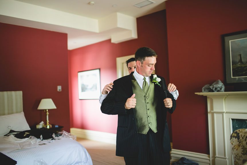 The groom gets ready at their suite at The Waddell as photographed by Documentary Style Wedding Photography studio.