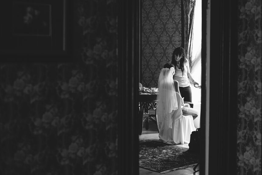 The elegant bride gets ready before her Penryn Mansion wedding as photographed by Documentary Style Wedding Photography studio.