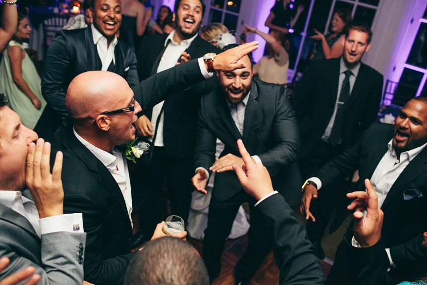 Toronto wedding photographer shoots wedding guests having a blasts at a Langdon Hall wedding.