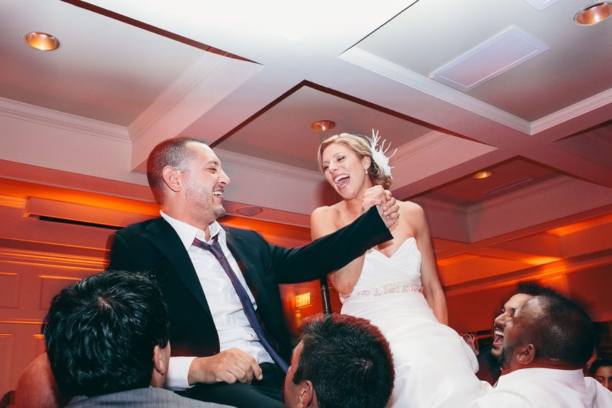 Newlyweds at their wedding reception at Langdon Hall by Toronto wedding photographer.