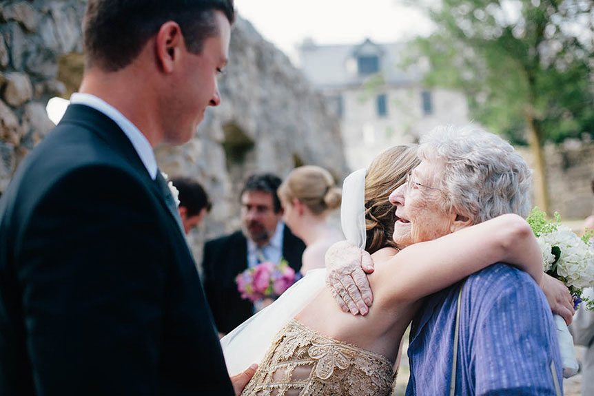 The bride hugs her grandmother after their wedding ceremony at Mill Race Park.