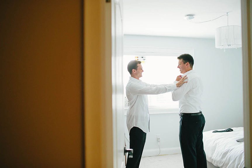 The groom gets ready before his wedding ceremony as photographed by Cambridge Documentary Wedding Photographer.