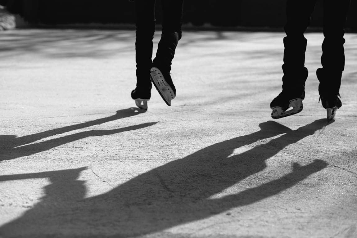 An engaged couple likes to skate as photographed by Kitchener wedding photographer.