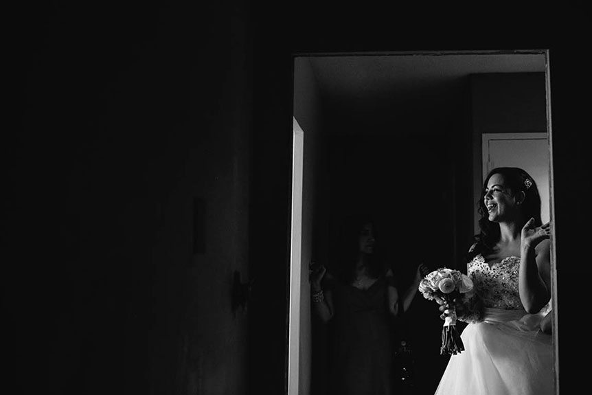 A candid moment of the bride photographed by Toronto documentary wedding photographer before her wedding ceremony.