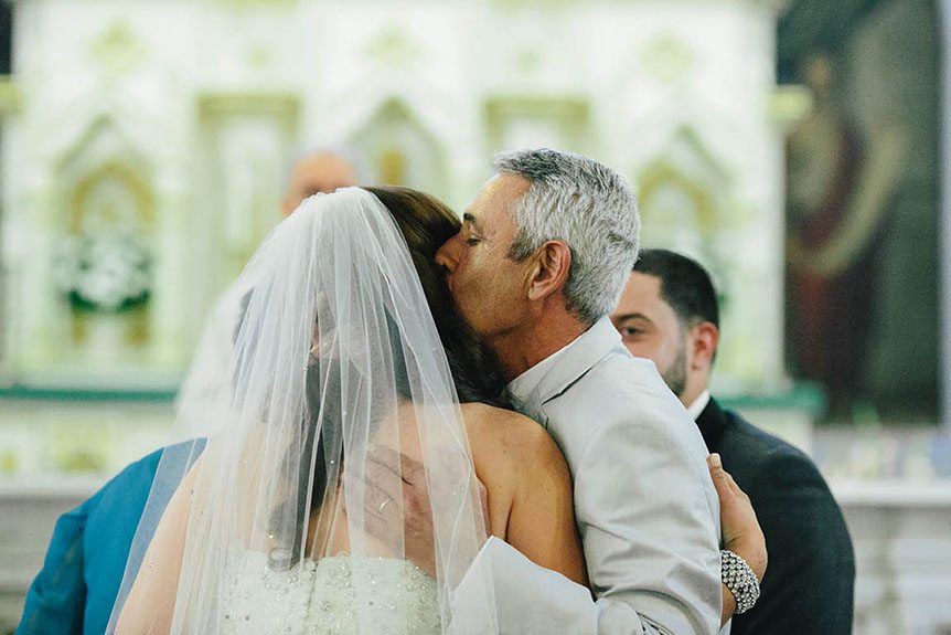 Toronto documentary wedding photographer captures the father giving his daughter away at a Toronto wedding ceremony.