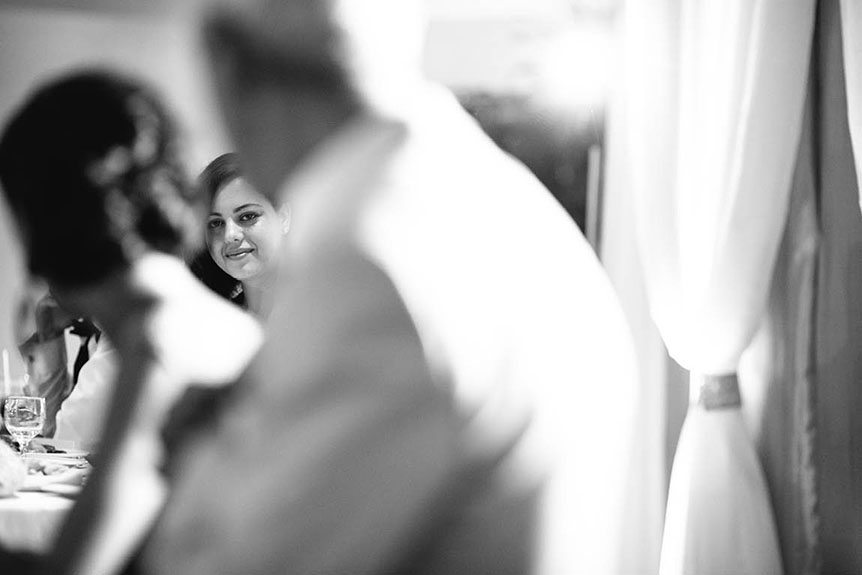 The bride reacts to the emotional speech as photographed by Toronto documentary wedding photographer.