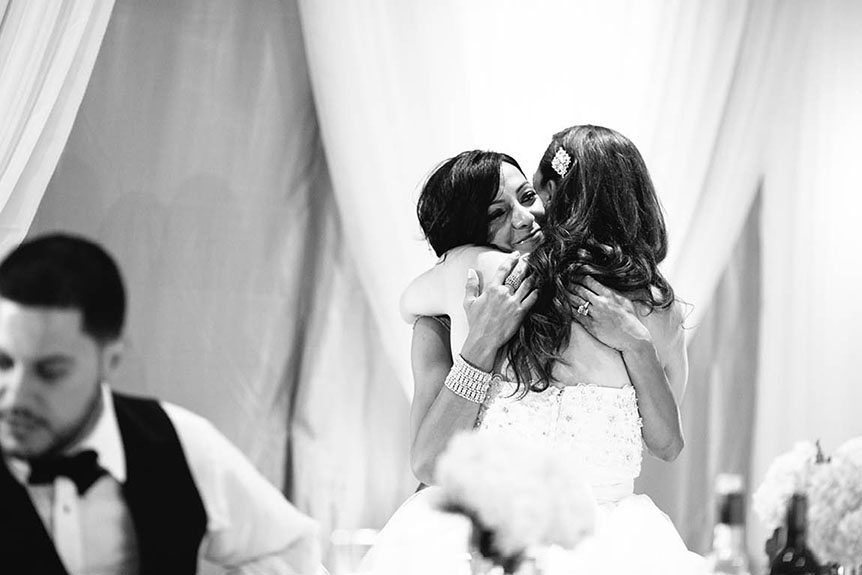 Toronto documentary wedding photographer photographs a beautiful moment between her bride and her family.