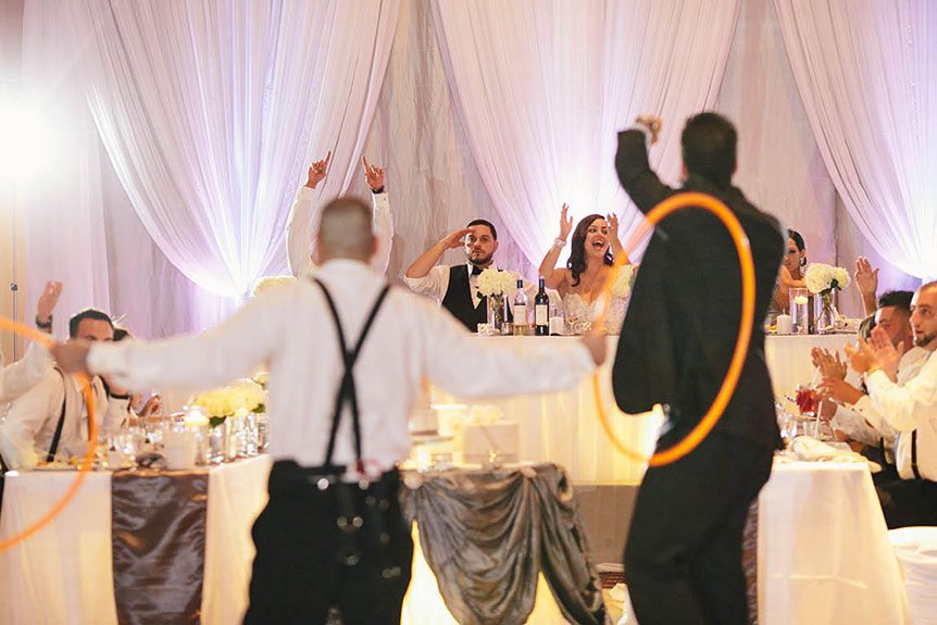 The bride and groom gets entertained during their wedding reception at the Burlington Convention Center.