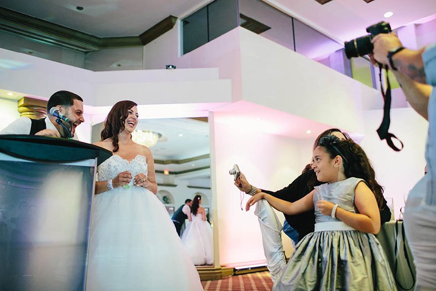 Toronto documentary wedding photographer photographs a happy moment during their speech at the Burlington Convention Center.