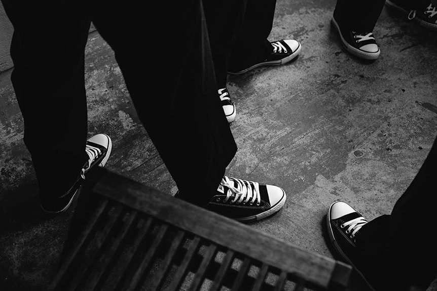 Toronto documentary wedding photographer captures a detail of the groomsmen shoes.