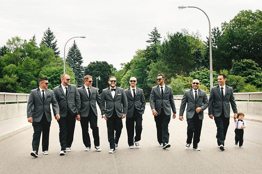 A portrait of the groom and his groomsmen by Toronto documentary wedding photographer.