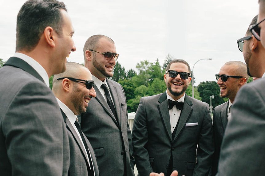 The groom and his groomsmen as photographed by Toronto documentary wedding photographer, having a great time.