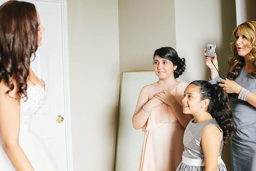 The bride takes her family's breaths away as photographed by Toronto documentary wedding photographer.