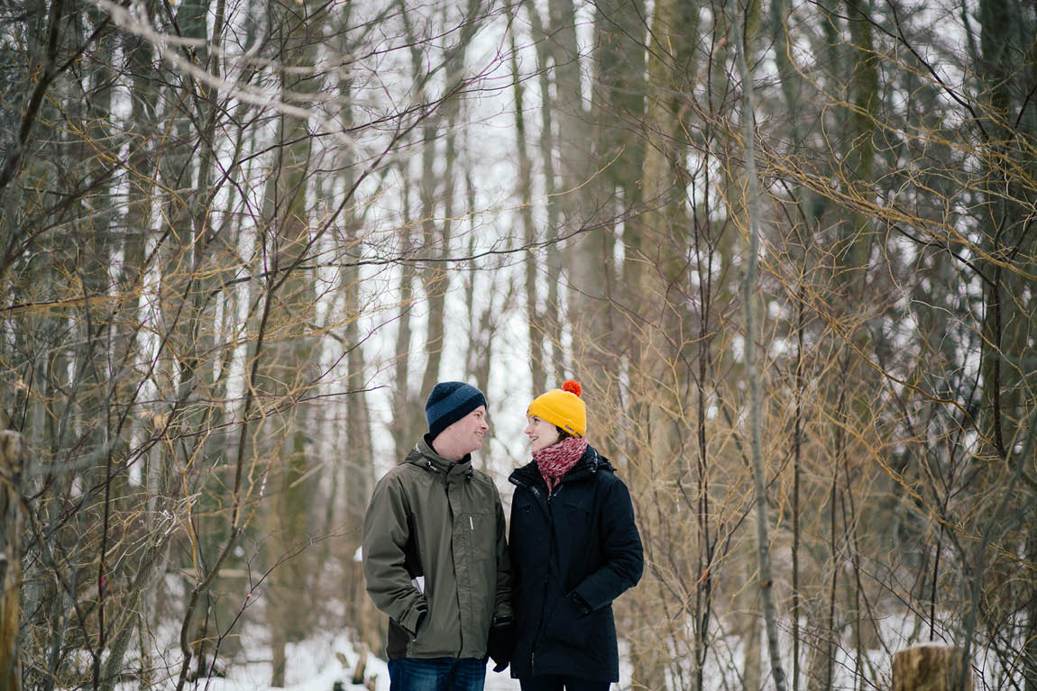 An engaged couple gets their engagement session done in the middle of the woods by Toronto wedding photographer.