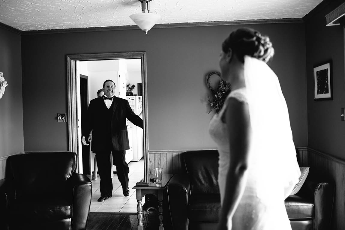 Wedding photojournalist captures the moment the father of the bride sees his daughter as a bride for the first time.