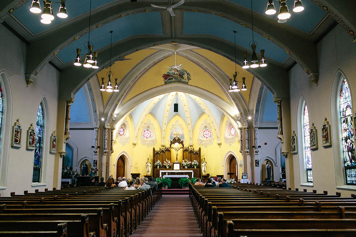 Kitchener wedding photojournalist photographs the inside of a Roman Catholic church.