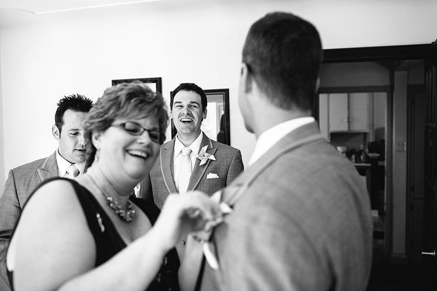 A candid moment while the groom got ready photographed by a wedding photographer in St Jacob's.