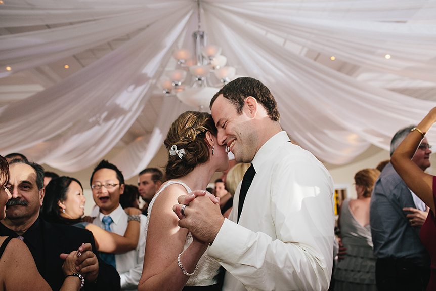 The bride and groom dances with their guests at their Three Bridges Banquet Hall wedding.