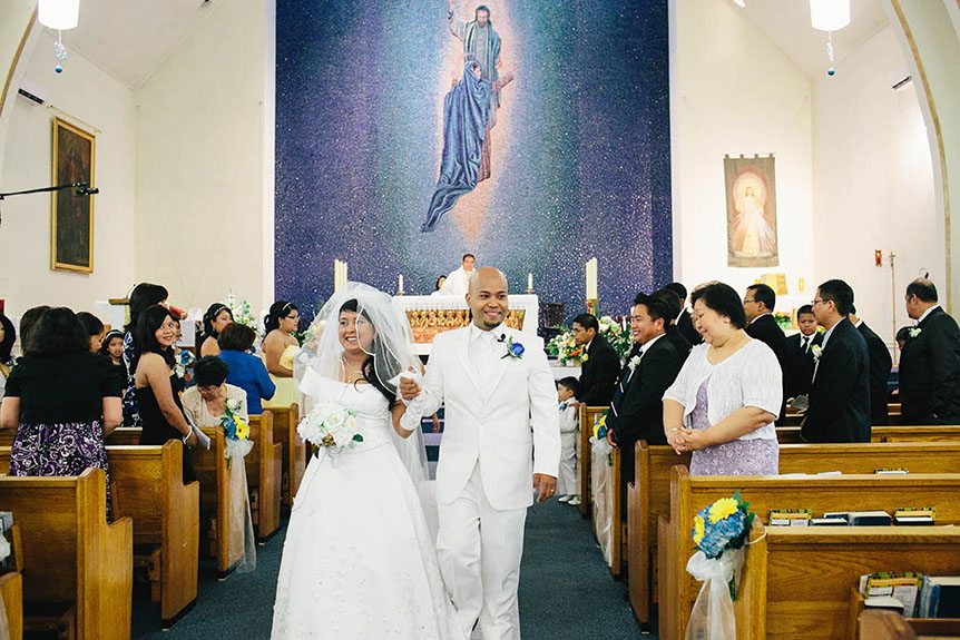 The newlyweds at a Roman Catholic wedding ceremony.
