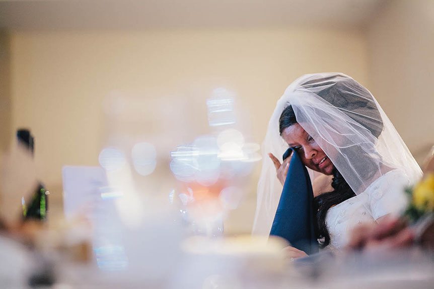 The bride has an emotional moment at her Grand Baccus Banquet wedding.
