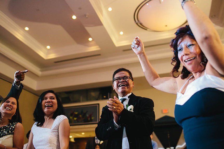 The wedding guests know how to party at a Filipino wedding reception.