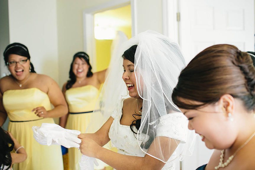 A Filipino bride and her bridesmaids have fun before the wedding ceremony.