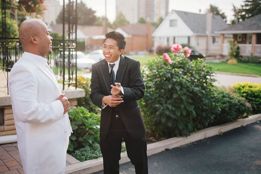 The groom and his best man jokes around before the wedding ceremony.