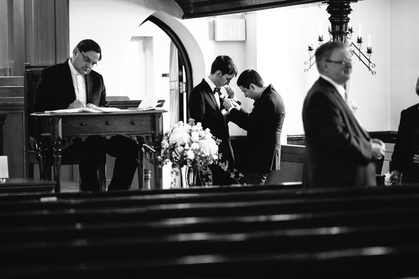 The groom gets ready at the church before the wedding ceremony in Streetsville.