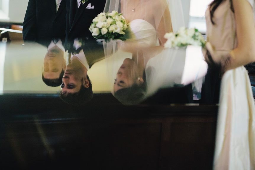 Reflection of the wedding party during a wedding ceremony.
