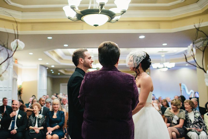 An indoor wedding ceremony at the Queen's Landing Hotel in Niagara-On-The-Lake.