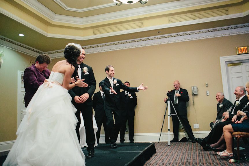 The best man does a jig at a wedding ceremony.
